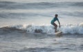 Kovalam, Chennai, Tamilnadu, India - Ã¢â¬Å½Ã¢â¬Å½August 9th Ã¢â¬Å½2021: Young boy Indian surfer surfing and practicing on the beach waves